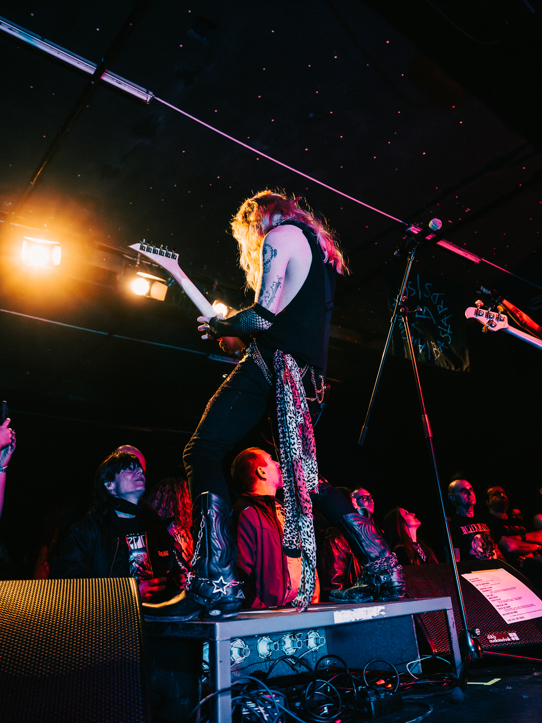 Stivie on stage with banner