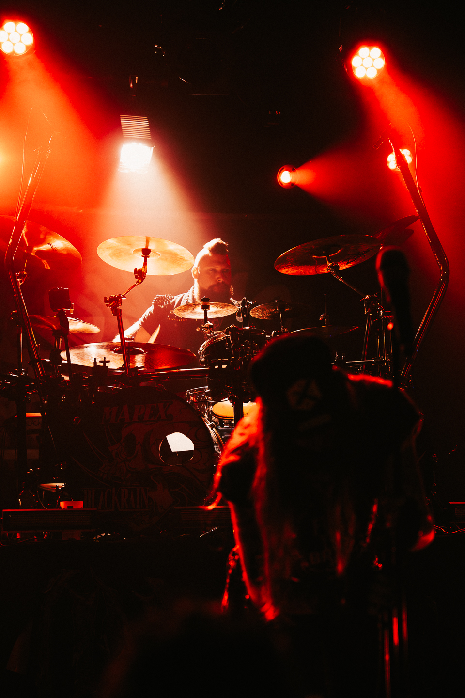 Dup on drums under red lights